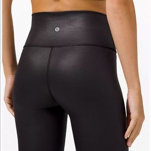 Brand new Lululemon high waisted shiny black leggings. Size 2
